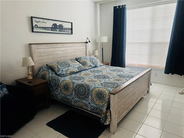 Bedroom with light tile patterned floors