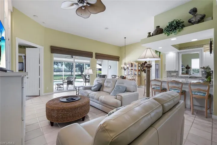 Expansive living area featuring light-toned tile flooring throughout