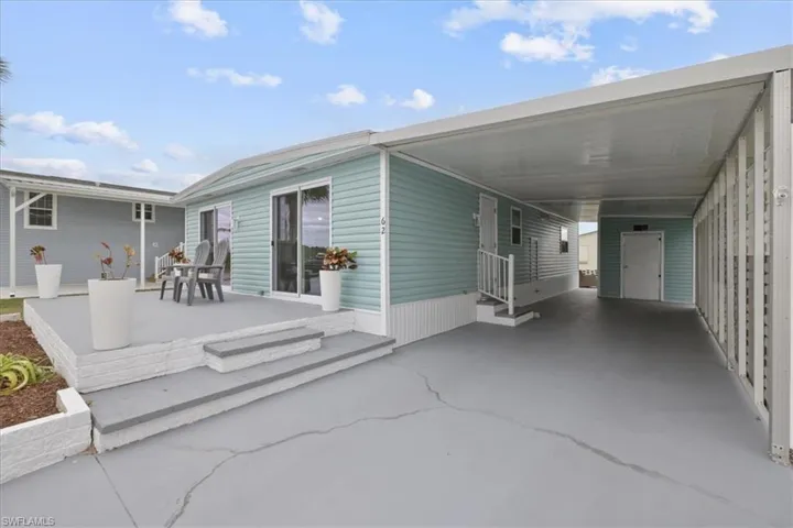 View of patio / terrace featuring a carport