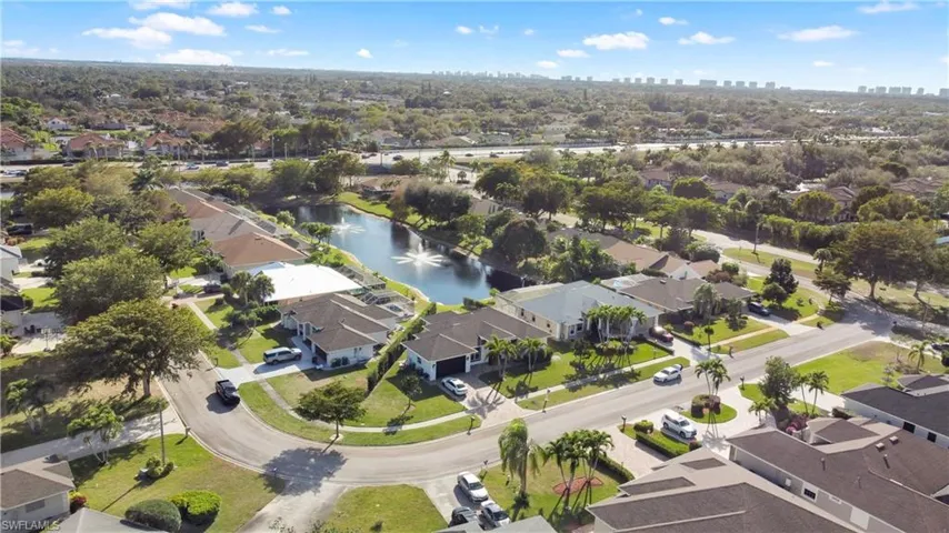 Aerial view of property's location with nearby suburban area and city skyline