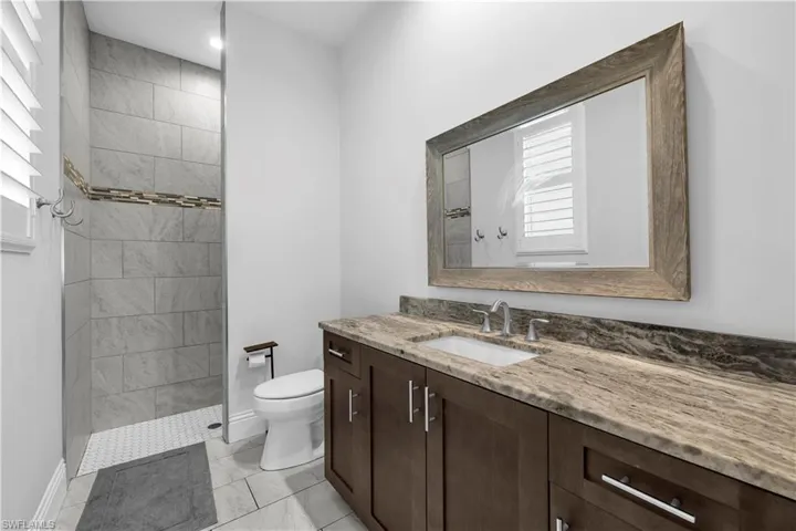 Full bathroom featuring vanity and walk in shower