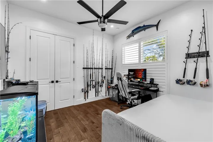 Bedroom featuring an office area, dark wood finished floors, a closet, ceiling fan, and recessed lighting