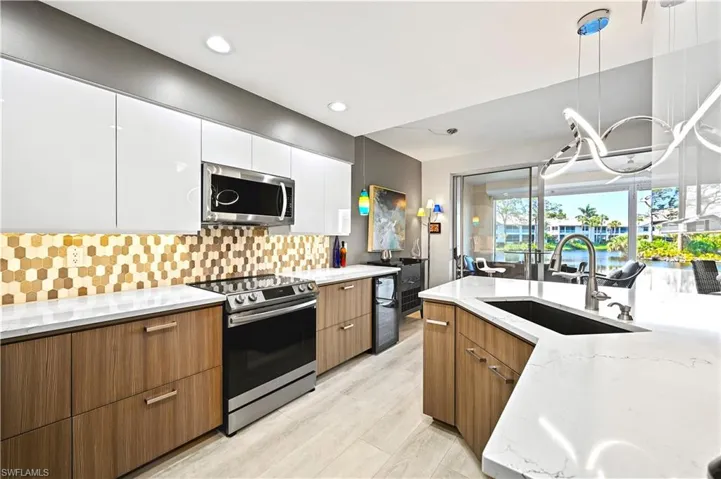 Clean and modern two-tone cabinets with thoughtful touches.