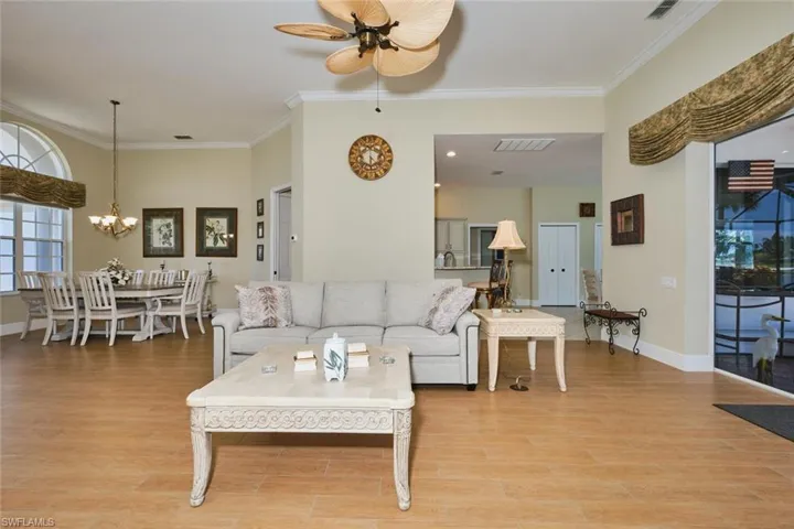 Carpeted bedroom featuring a closet and ceiling fan
