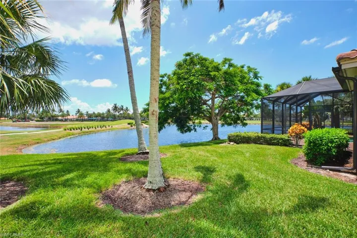 Outdoor pool featuring ceiling fan, a patio, and a lanai