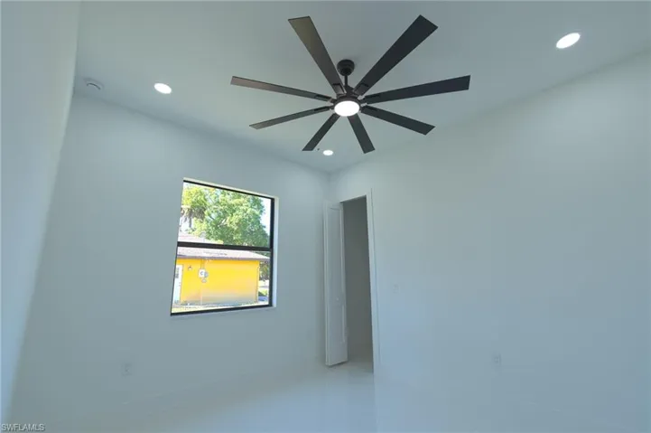 Spare room with recessed lighting, tile patterned floors, and ceiling fan