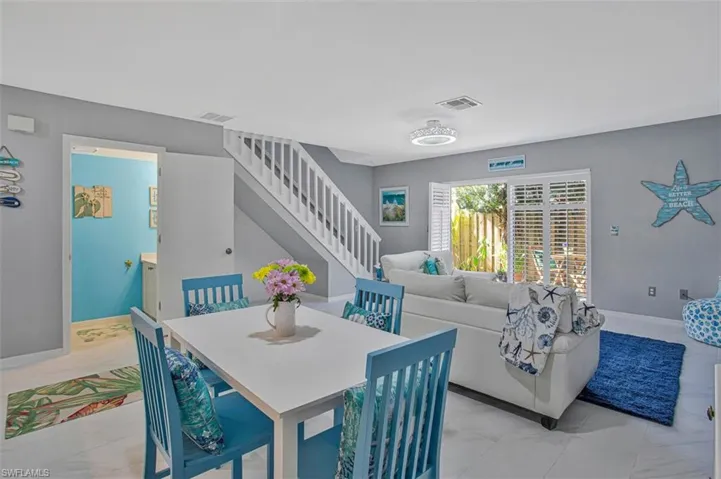 Dining space with baseboards and stairs