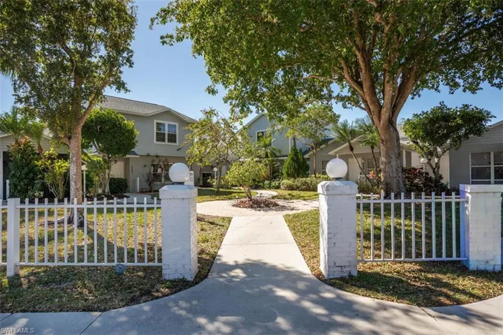 Obstructed view of property with a fenced front yard