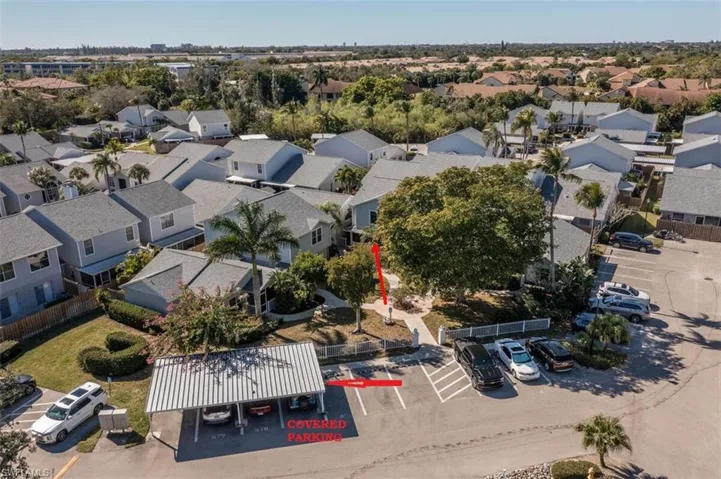 Aerial view of property's location featuring nearby suburban area