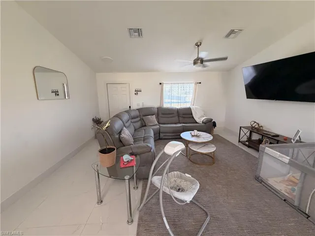 Bright interior space featuring light-toned tile flooring