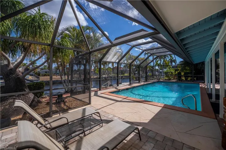 Beautiful Heated pool and lanai area overlooking the water