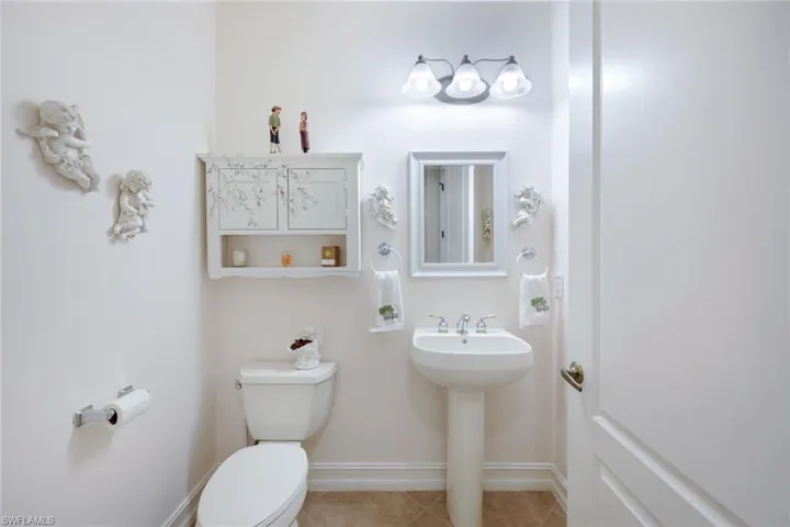 Bathroom featuring toilet and tile patterned floors