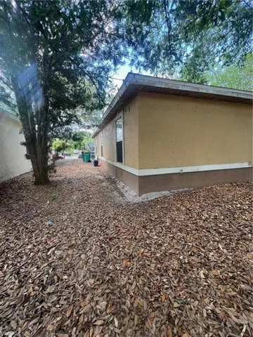 View of property exterior with stucco siding
