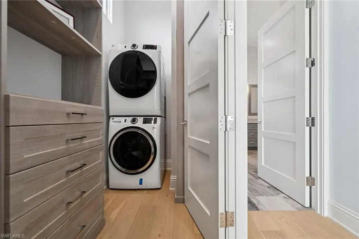 Primary LaundryLiving area sq ft = 3,820First Floor garage = 1,603 sq feet with front and back entry.  Lanai + 4 Balconies + Front porch= 1,120Total square footage = 6,543Primary Bedroom Laundry