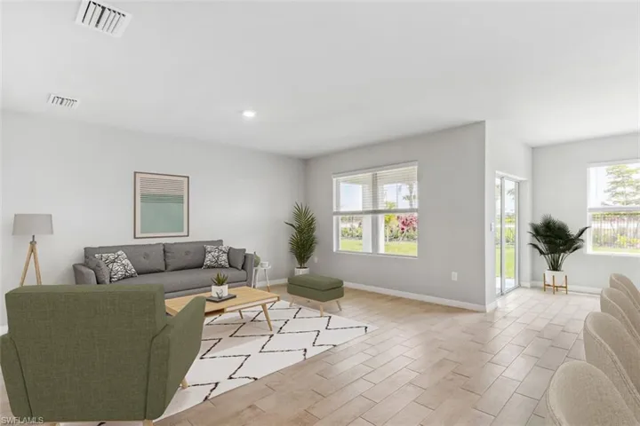 Virtually Staged-Living room featuring healthy amount of natural light, wood finish floors, and recessed lighting