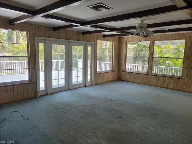 HUGE open living room dining room and kitchen kitchen area with lots of natural light and big windows.