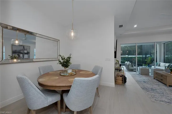 Dining area featuring a tray ceiling