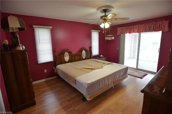 Master bedroom with slider to pool area.