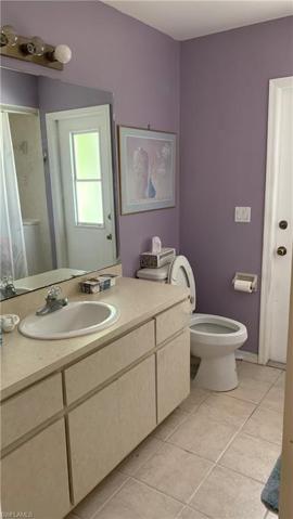 Bathroom 2 with door to pool area.