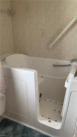 Walk in tub/shower in Bathroom 2.