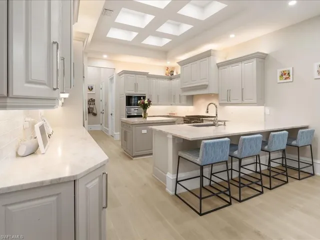 Gourmet kitchen with striking architectural detail in the ceiling.