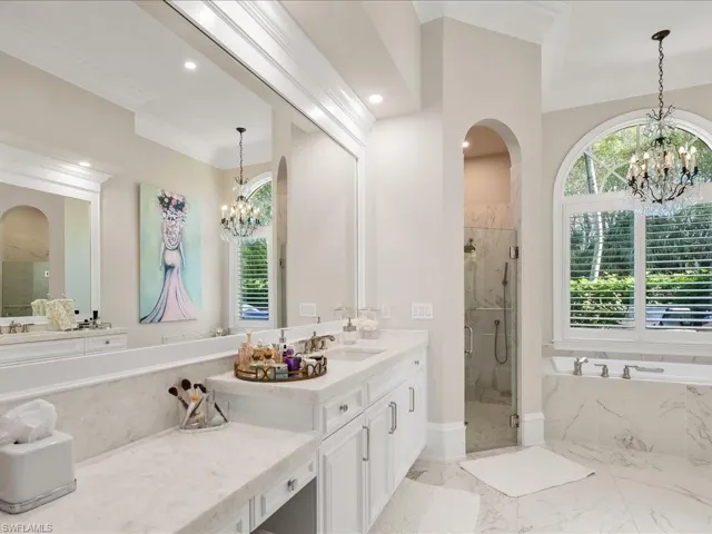 Updated primary bathroom with dual sinks, separate shower and tub