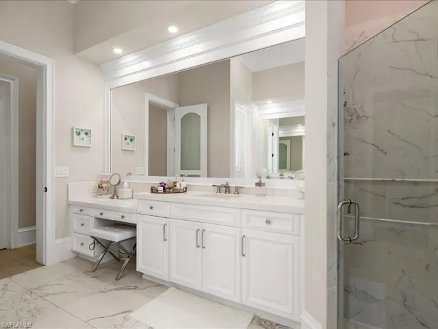 Updated primary bathroom with dual sinks, separate shower and tub