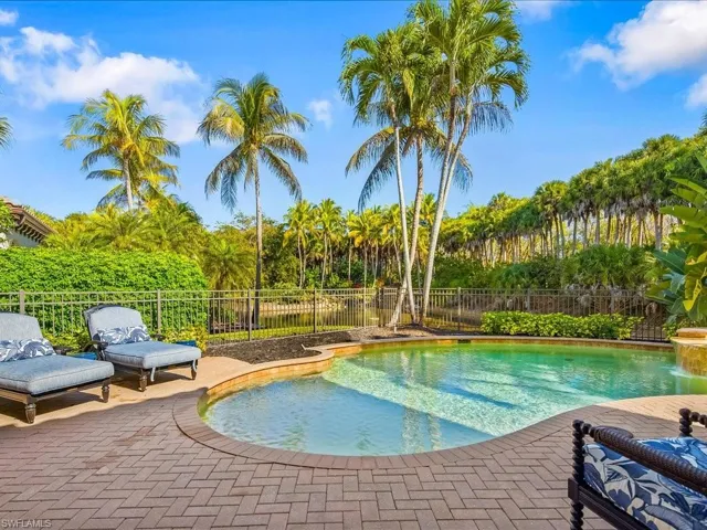 Integrated pool / spa with a patio area, french doors, and a fenced backyard