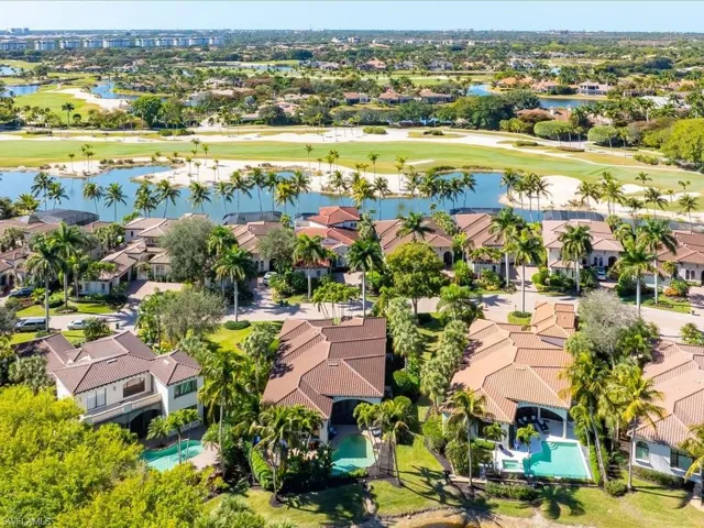 Aerial view of residential area of Capistrano with the golf course and a lake in the background