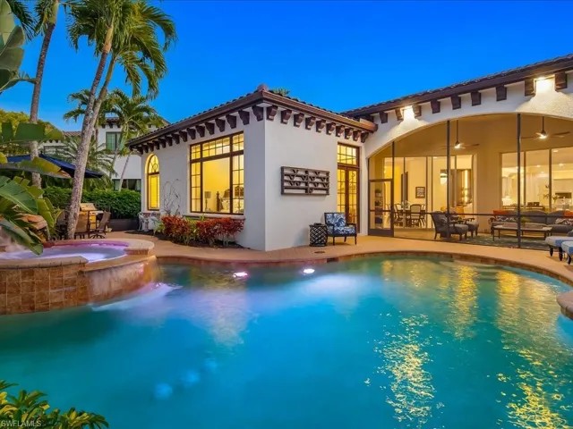 Mediterranean / spanish-style house featuring pool, spa, and screened in lanai.