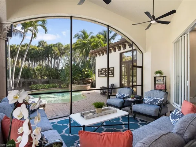 Screened patio looking into the pool and spa area.
