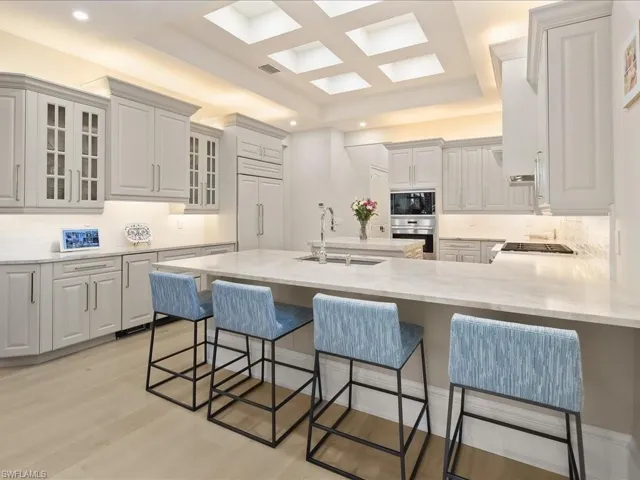 Light, bright gourmet kitchen with Sub-zero, Wolff, and Bosch appliances.  Dual refrigerater drawers, icemaker and leathered Taj Mahal quartzite countertops provide a luxurious feel.