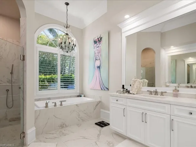 Updated primary bathroom with dual sinks, separate shower and tub