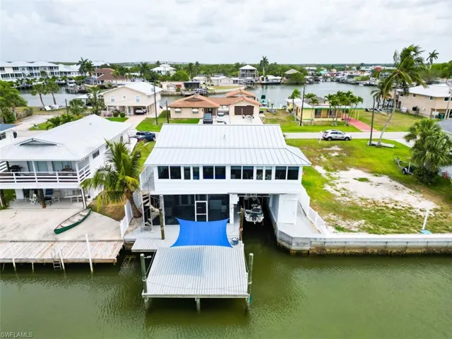 Aerial perspective of suburban area with a large body of water
