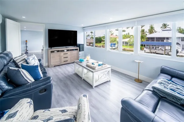 Living room featuring light wood finished floors and recessed lighting