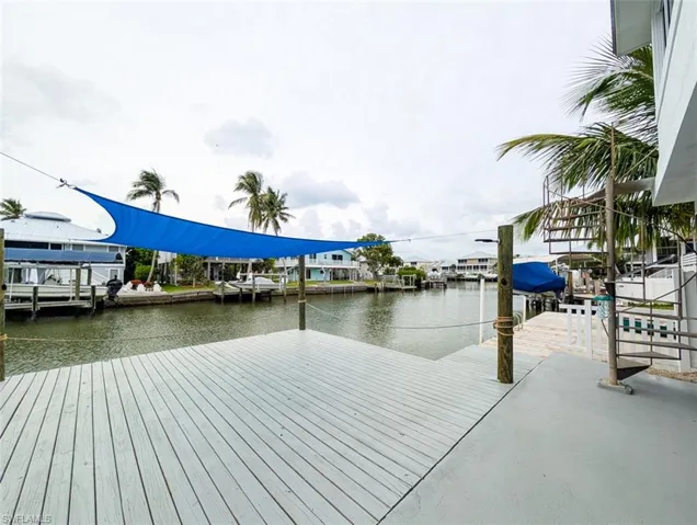 Dock area featuring a water view and boat lift