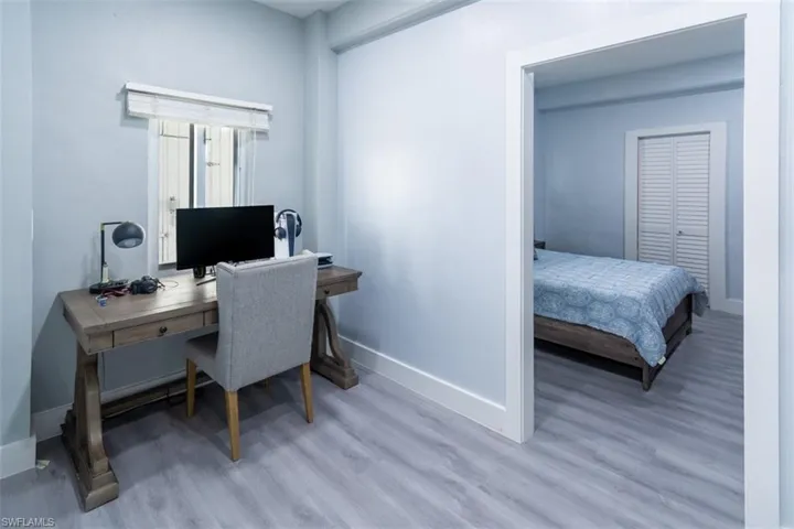 Home office featuring baseboards and light wood-style floors