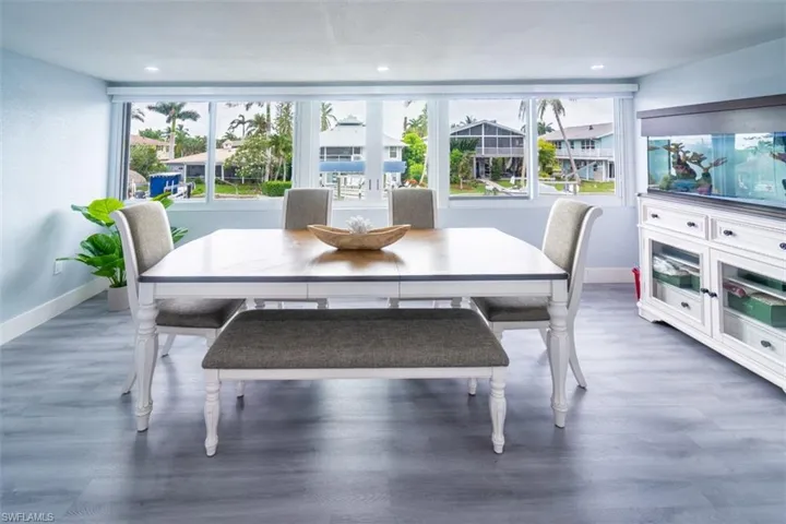 Dining area featuring plenty of natural light and wood finished floors
