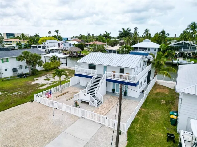 Aerial perspective of suburban area with a nearby body of water