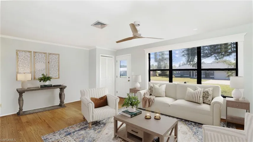 Photo includes virtual staging to showcase the possibility of the living room.