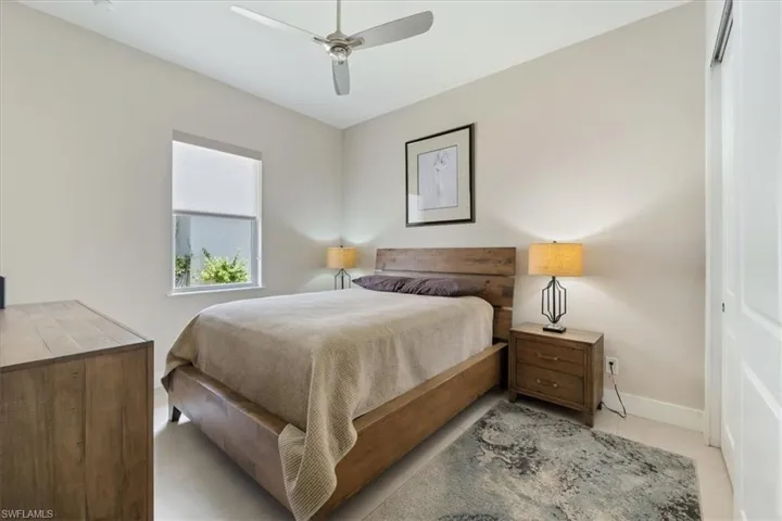 Bedroom with baseboards and a ceiling fan