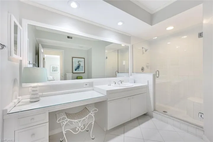Full bathroom featuring crown molding, a stall shower, vanity, recessed lighting, and light tile patterned floors