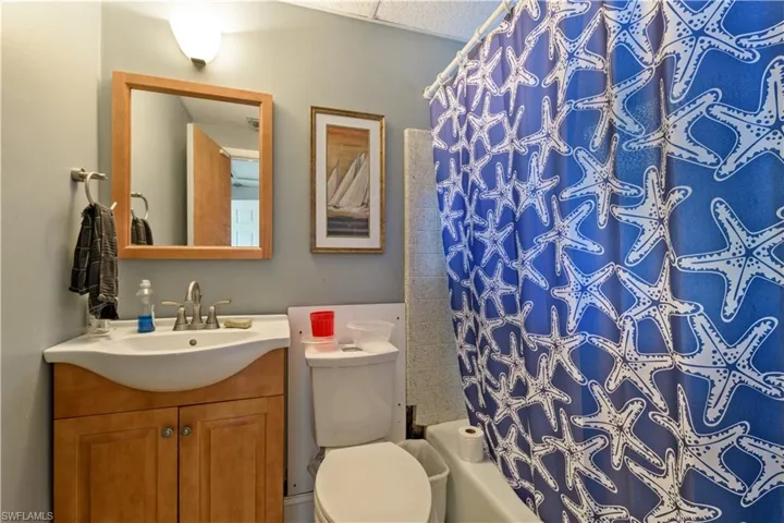 Bathroom with vanity and shower / bath combo