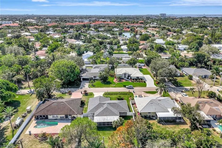 Aerial overview of property's location with nearby suburban area