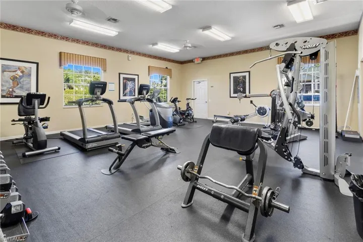 Workout area featuring visible vents and baseboards