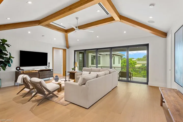 Living room featuring ceiling fan, light wood-type flooring, baseboards, and recessed lighting