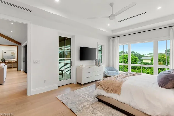 Bedroom with access to outside, light wood-style floors, recessed lighting, baseboards, and a ceiling fan