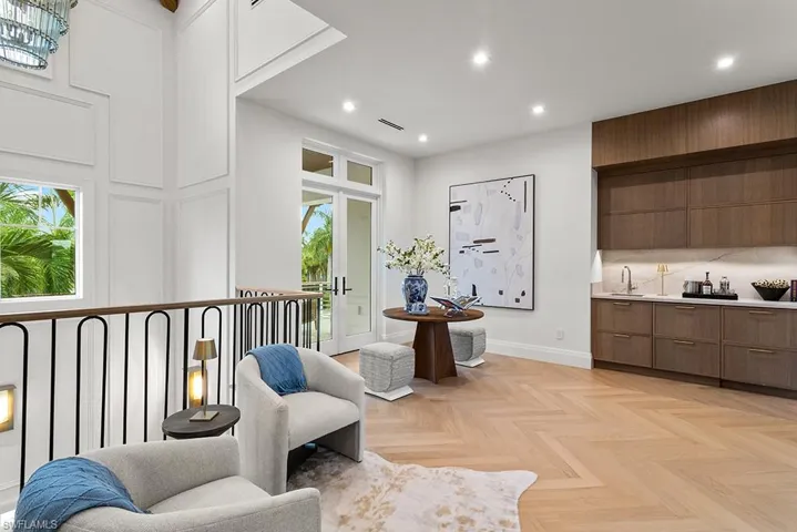 Living area with healthy amount of natural light, recessed lighting, and baseboards