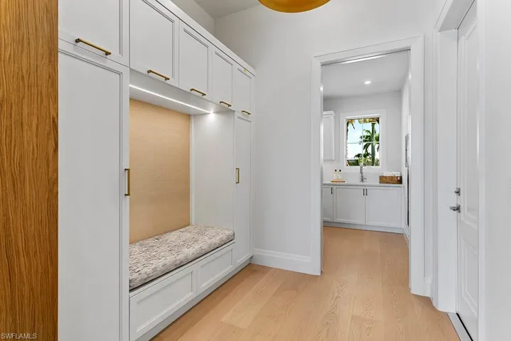 Mudroom featuring light wood-type flooring, recessed lighting, and baseboards
