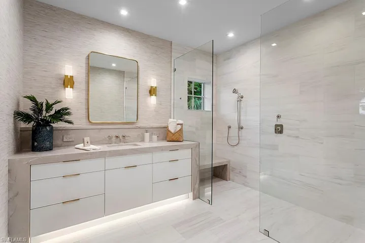 Full bath featuring walk in shower, vanity, and recessed lighting